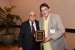 Dr. Nagib Callaos, General Chair, giving Dr. Bruce E. Peoples a plaque "In Appreciation for Delivering a Great Keynote Address at a Plenary Session."